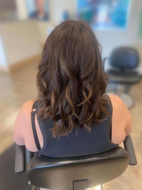 Styled hair with a smooth, polished finish.